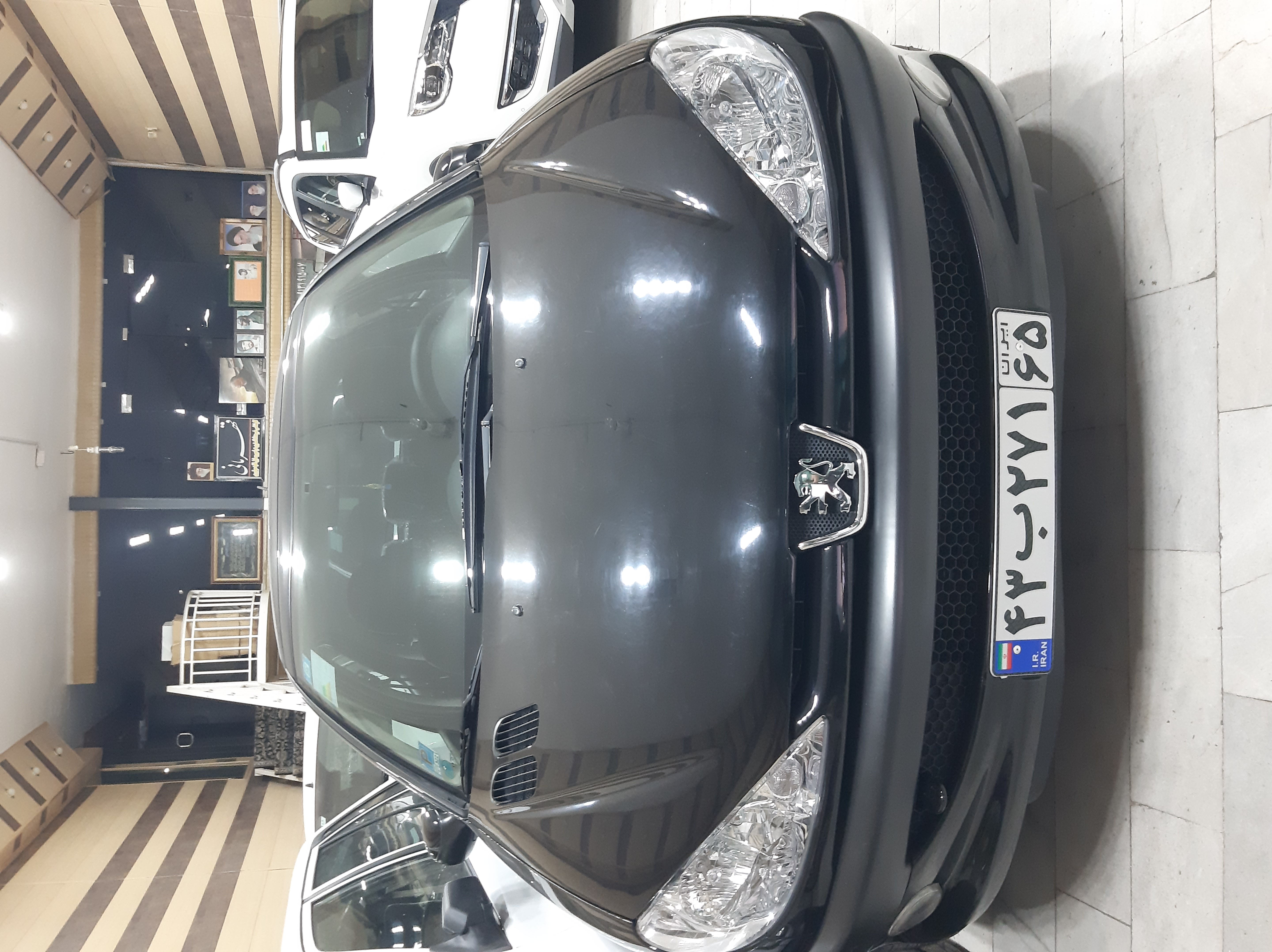 پژو 206 سفارشی تیپ 3 رنگ مشکی مدل 401 رینگ اسپرت سقف پانورما