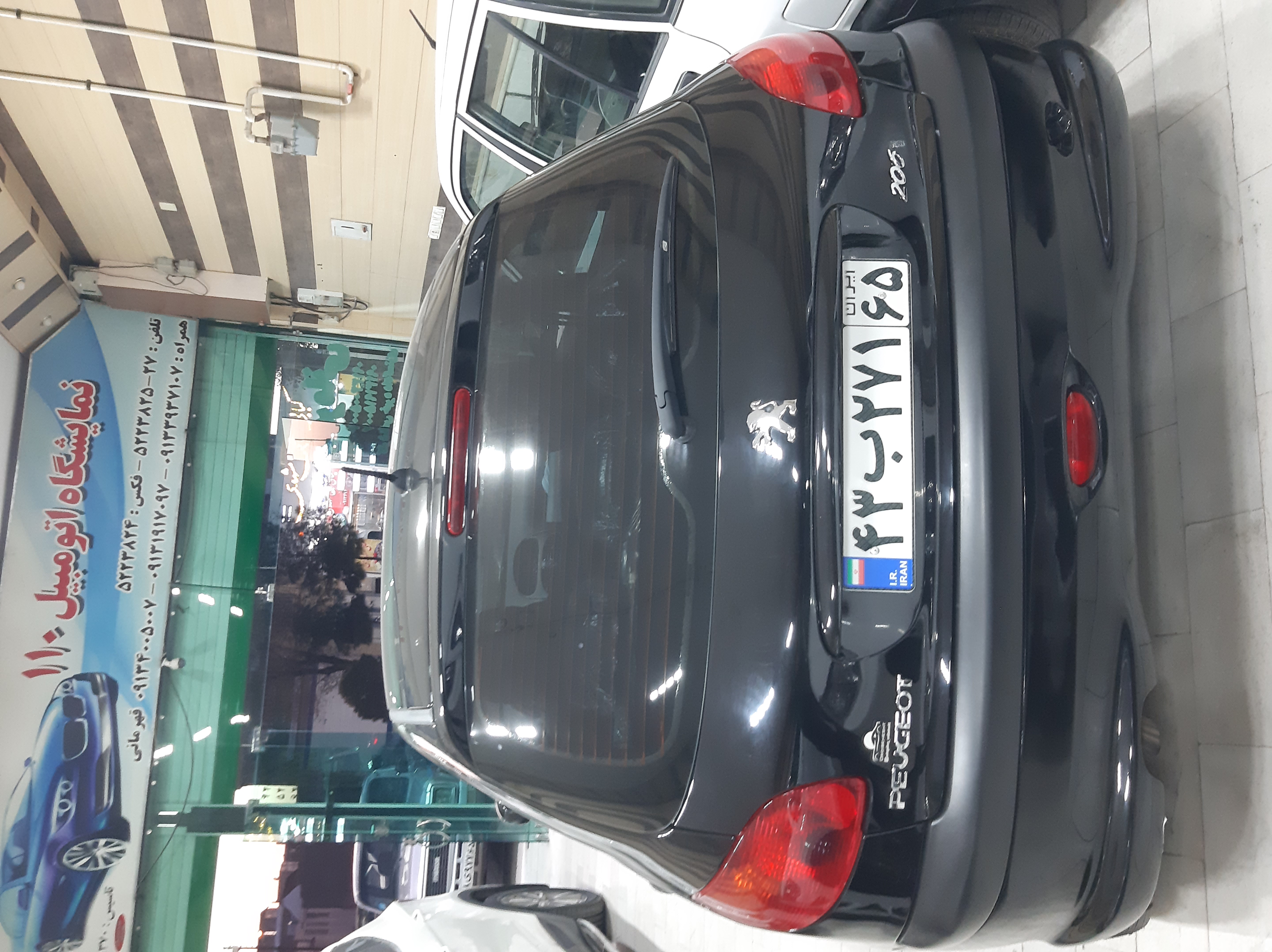 پژو 206 سفارشی تیپ 3 رنگ مشکی مدل 401 رینگ اسپرت سقف پانورما